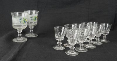 a lot of wine glasses that are sitting on a table