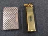 two different types of lighters sitting on top of a table
