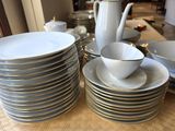 a lot of plates and cups on the table