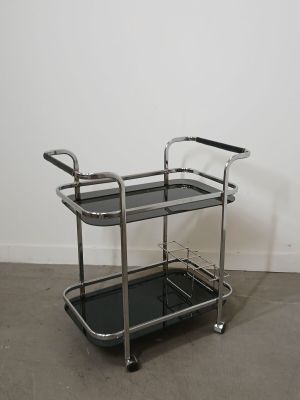 a black and chrome serving cart with two shelves on wheels