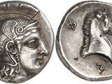a close up of a silver coin with a horse on it