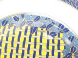 a plate with a blue and yellow design on it