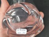 a person holding a glass bottle with a label on it