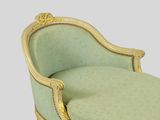 an image of a chaise lounger with a green upholstered seat