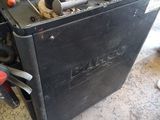 a machine that is sitting on the ground in the garage