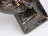 an image of a bronze sculpture of a man ' s head