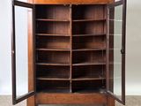 a wooden cabinet with a glass door and shelves