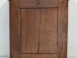 an old wooden cabinet with a drawer on top of it