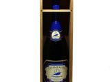 a bottle of champagne in a wooden box on a white background