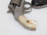 an old gun with a bone in it on a table