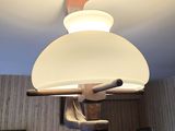 a lamp that is hanging from the ceiling in a room