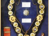 an image of a display case with a necklace and other items