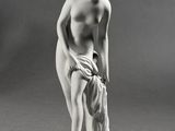 black and white photograph of a statue of a woman holding a towel