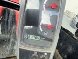 a close up of a car ' s dashboard with a clock on it