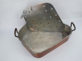 a metal pan that has a handle on it