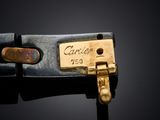 a close up of a black leather belt with a gold buckle