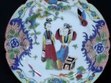 a plate with a picture of a man and a woman on it
