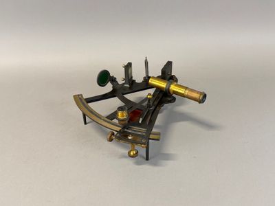 an old brass sexet on a white surface with a white background