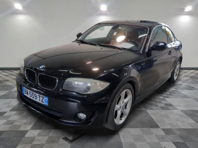 a picture of a black car parked in a garage