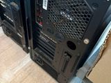 two computers sitting on top of each other on the floor