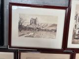 four framed pictures of a city and a building