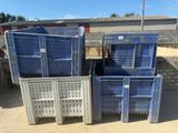 many crates that are stacked up in the dirt
