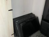a lot of televisions that are sitting on the floor
