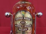 bottle of chivas regal blended scotch whisky on display on red background