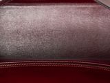 the inside of a red purse with a zipper on it