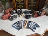 many different types of cameras on a table