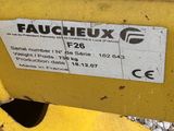 a close up of a yellow machine with a sticker on it