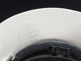 a close up of a white hat with a black band