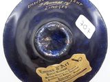 an image of a blue vase with a label on it