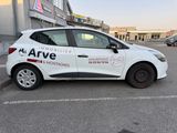 a white car that is parked in a parking lot