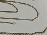 a silver chain with a gold chain attached to it