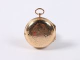 a close up of a gold locke on a white background