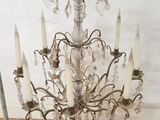 a chandelier that has a bunch of candles on it