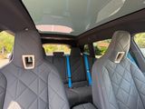two seats in the back of a car with a sunroof