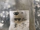 a close up of a piece of metal with a tag on it