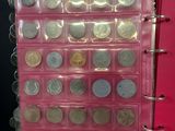 a picture of a pink binder with a bunch of coins in it