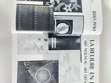 two books on the table with pictures of objects on them