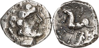 a close up of a silver coin with a bird on it