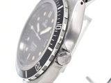 a close up of a watch on a metal bracelet