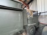 a military truck with a horse on the back
