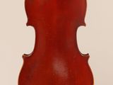 an old violin with a wooden back and a brown body