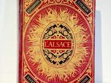 a red and gold book with a picture of a palace on it