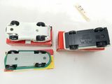 three toy cars that are sitting on a table