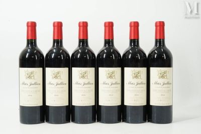 six bottles of red wine are lined up in a row