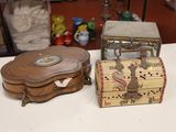 a small wooden box and a small wooden box sitting on a table