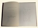 an open book with a handwritten poem inside of it
